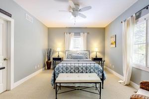 a bedroom with a bed and a ceiling fan at The Lighthouse in Lakeshore Cottages in Union Pier +23 photos