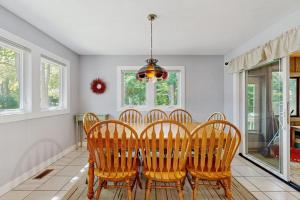 a dining room with a table and four chairs at The Treehouse in Thompsonville +16 photos