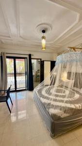 a bedroom with a large bed in a room at Jade guest House in Dakar