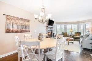 a dining room and living room with a table and chairs at Mountain Top 713 in Thompsonville