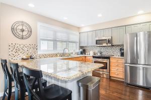 a kitchen with a large counter and a refrigerator at Mountain Top 713 in Thompsonville