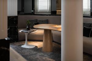 a table and a bench in a room at Macalister Mansion, a Member of Design Hotels in George Town +27 photos