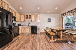 a kitchen with wooden cabinets and a wooden table at The Raccoon in Conover +37 photos