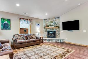a living room with a couch and a fireplace at The Eagle in Conover