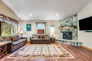 a living room with a couch and a fireplace at The Eagle in Conover
