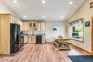 a large kitchen with a table and a refrigerator at The Eagle in Conover +50 photos