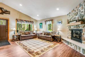 a living room with a couch and a fireplace at The Woodland in Conover