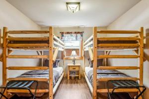 two bunk beds in a small room with a desk at The Woodland in Conover +52 photos