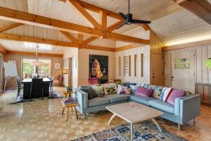 a living room with a couch and a table at Northwoods Oasis in Land O' Lakes +30 photos