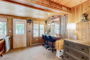 a home office with a desk and blue chairs at Stormy Point Cabin in Conover