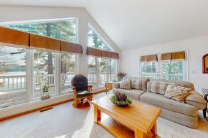 a living room with a couch and a table at Yellow Birch Memories in Eagle River