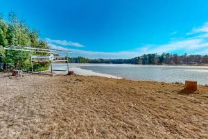a soccer goal on a beach next to a body of water at Yellow Birch Memories in Eagle River