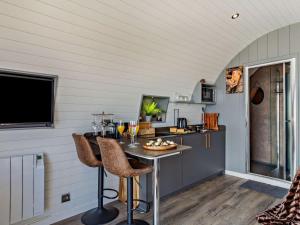 a kitchen with a table and chairs in a room at 1 Bed in South Brent oc-86947 in South Brent