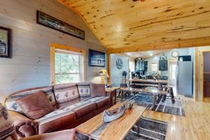 a living room with a couch and a table at The Korn Krib in Mercer