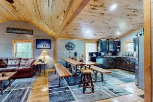 a kitchen and living room with a wooden ceiling at The Korn Krib in Mercer