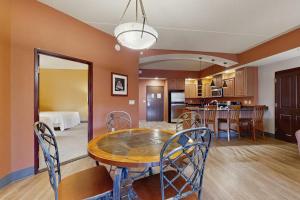a dining room and kitchen with a table and chairs at Chula Vista Resort 2224 & 2226 in Wisconsin Dells