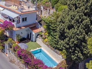 an aerial view of a house with a swimming pool at Paulette in Éze