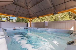 a large swimming pool with a large roof at The Beaver in Conover