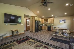 a large living room with a kitchen with a flat screen tv at The Beaver in Conover +50 photos