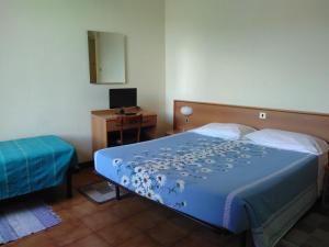 Rúm í herbergi á Albergo Bandoni