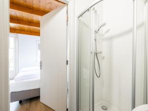 a glass shower door in a bathroom with a bed at de Sedyk in Pietersbierum +56 photos