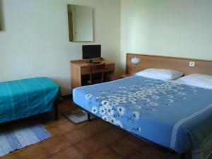 Rúm í herbergi á Albergo Bandoni