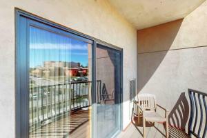 a balcony with a chair and a large window at Chula Vista Resort 2224 in Wisconsin Dells