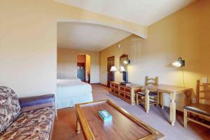 a hotel room with a bed and a table at Chula Vista Resort 2224 in Wisconsin Dells