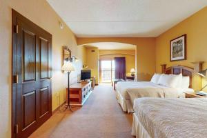 a hotel room with two beds and a door at Chula Vista Resort 2224 in Wisconsin Dells +10 photos