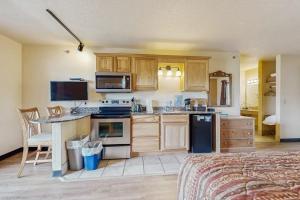 a kitchen with wooden cabinets and a counter top at Chula Vista Resort Villa # 7212 in Wisconsin Dells