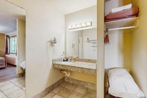 a hotel room with a sink and a mirror at Chula Vista Resort Villa # 7212 in Wisconsin Dells +20 photos