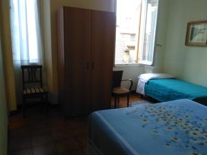 Rúm í herbergi á Albergo Bandoni