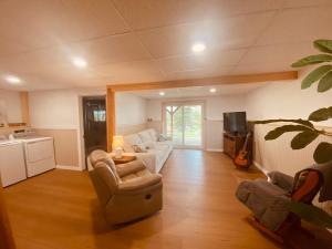 a living room with a couch and a table at 5 bedroom Waterfront house in Tracadie