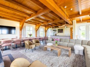 a living room with a couch and a table at de Sedyk in Pietersbierum