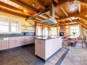 a kitchen with wooden ceilings and a large counter top at de Sedyk in Pietersbierum