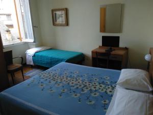 Rúm í herbergi á Albergo Bandoni