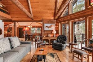a living room with a couch and a table at Sailor's Point Lodge in Eagle River