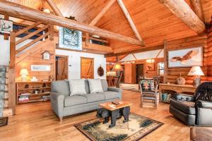 a living room with a couch and a table at Sailor's Point Lodge in Eagle River