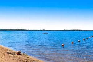 a large body of water with a row of balls in it at Sunset Condominiums: Golf View in Arkdale