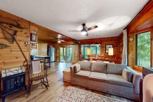 a living room with a couch and a fireplace at Northwoods Resort in Woodruff +32 photos