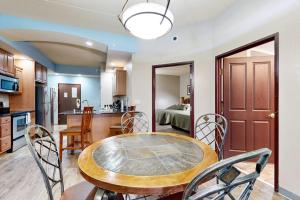 a kitchen and dining room with a table and chairs at Chula Vista Condo 2344 and 2346 in Wisconsin Dells