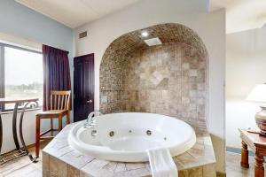 a large bathroom with a large tub in a room at Chula Vista Condo 2344 and 2346 in Wisconsin Dells +20 photos