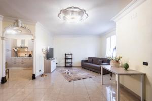 a living room with a couch and a table at Casa Amica in Avola +30 photos