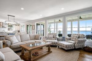 a living room with a couch and chairs and a table at Summer Breeze in Sayner