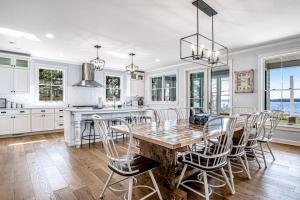 a kitchen with a wooden table and chairs at Summer Breeze in Sayner