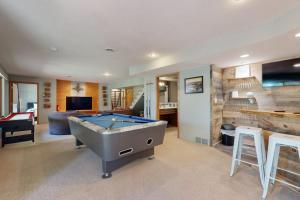 a large room with a pool table in it at Par for the Course in New Rome