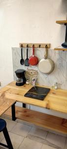 a kitchen counter with a sink and some utensils at Loft #1 a una cuadra de Playa Regatas Oyster Suites in Veracruz