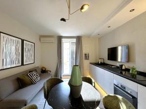 a living room with a table and a couch at Casa Lumae in Noto
