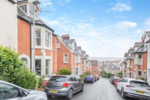 a city street with cars parked on the street at 4 Bed in Swanage oc-a29454 in Swanage