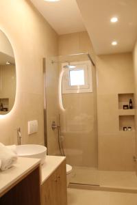 a bathroom with a shower and a sink at Villa Martha in Benitses +63 photos